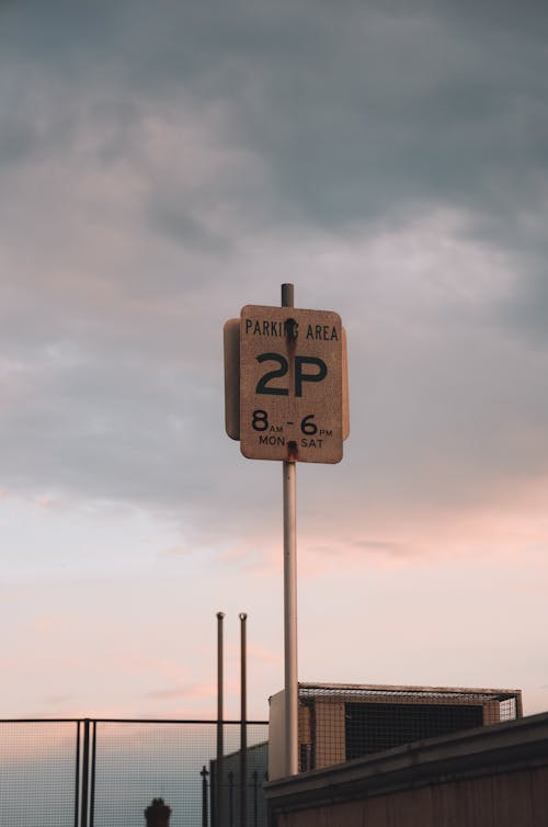 Signboard Post udner Cloudy Sky 