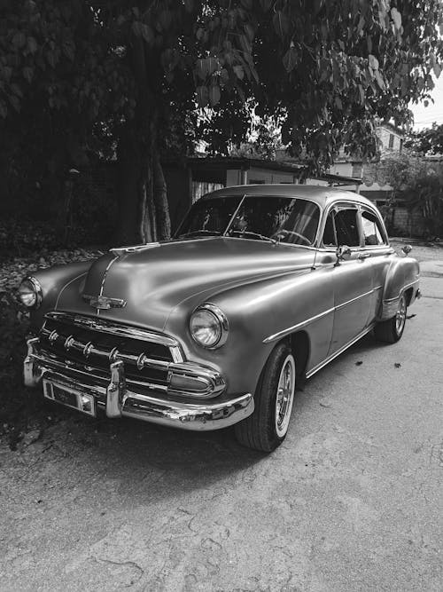 Grayscale Photo of Vintage Car