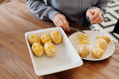 Person Carving Potatoes