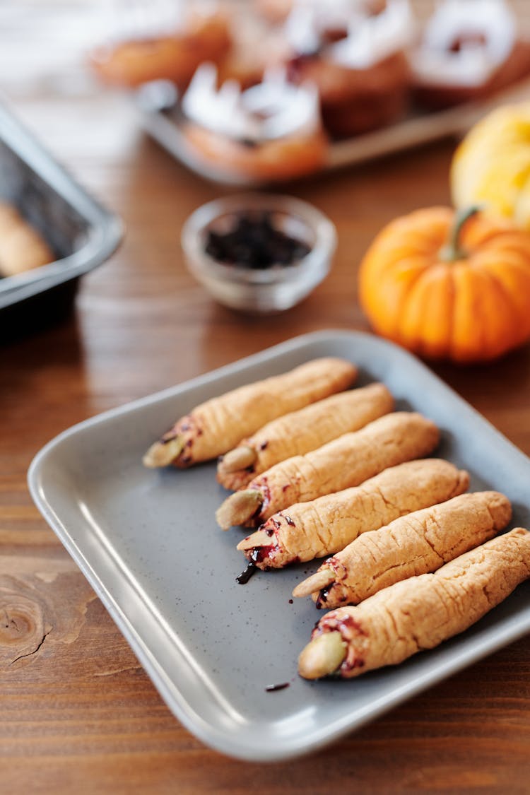 Grilled Sausages With Witch Fingers Design On A Tray