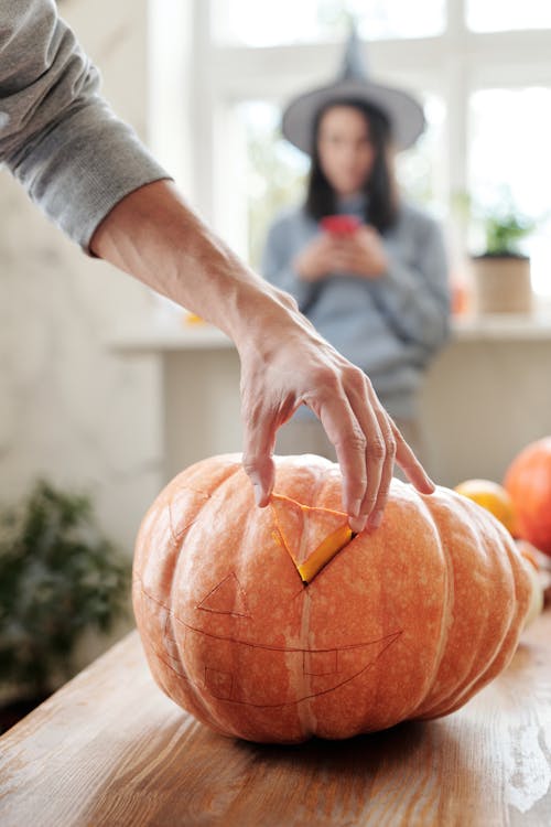 Free Man Carving A Pumpkin Stock Photo