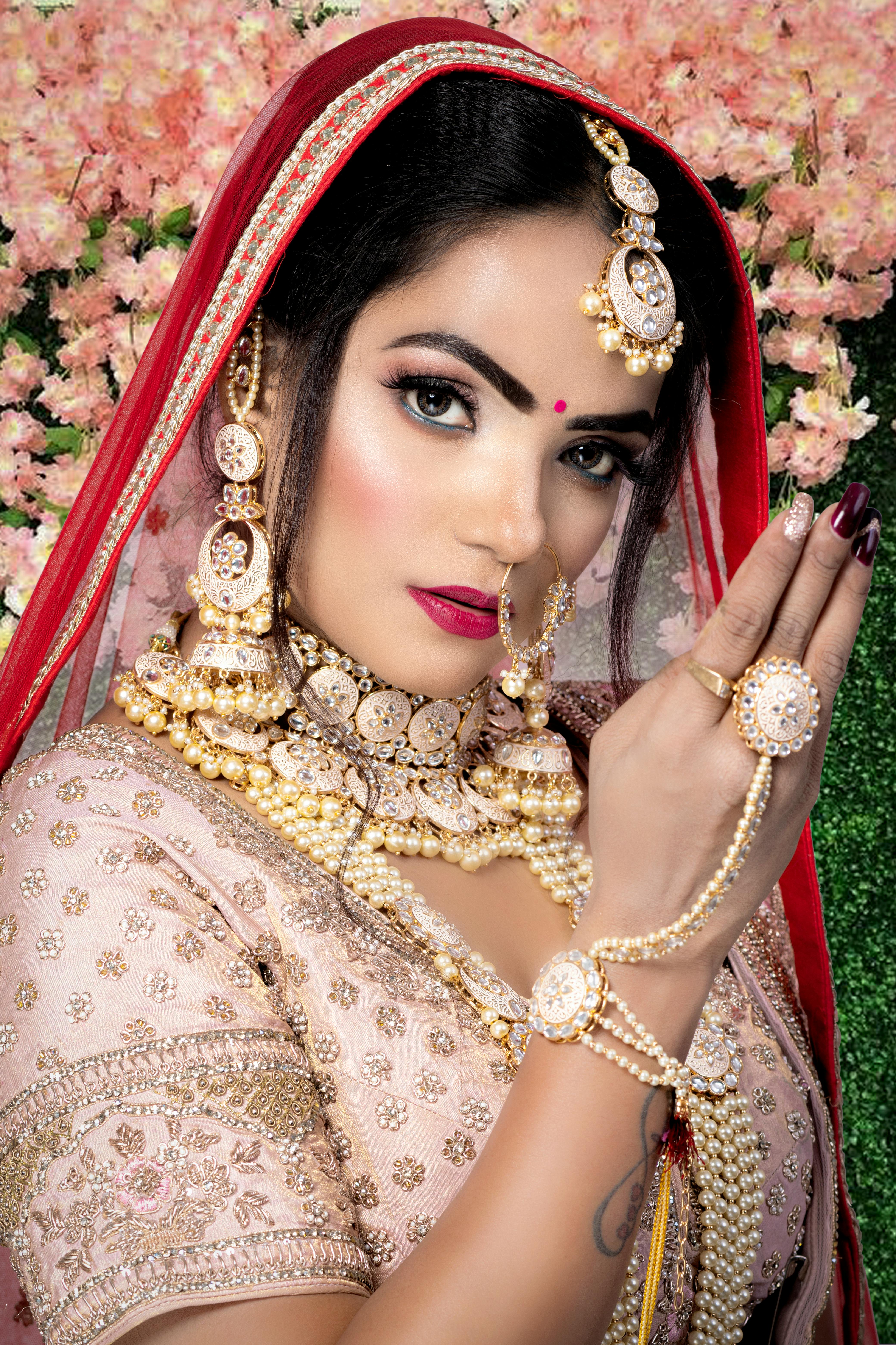 Woman in Gold and Red Floral Dress