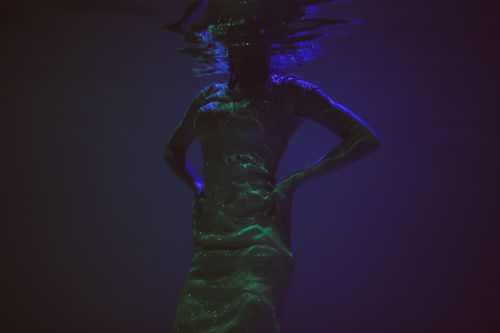 Free Artistic underwater silhouette with sparkling effects, exuding a mystical allure. Stock Photo