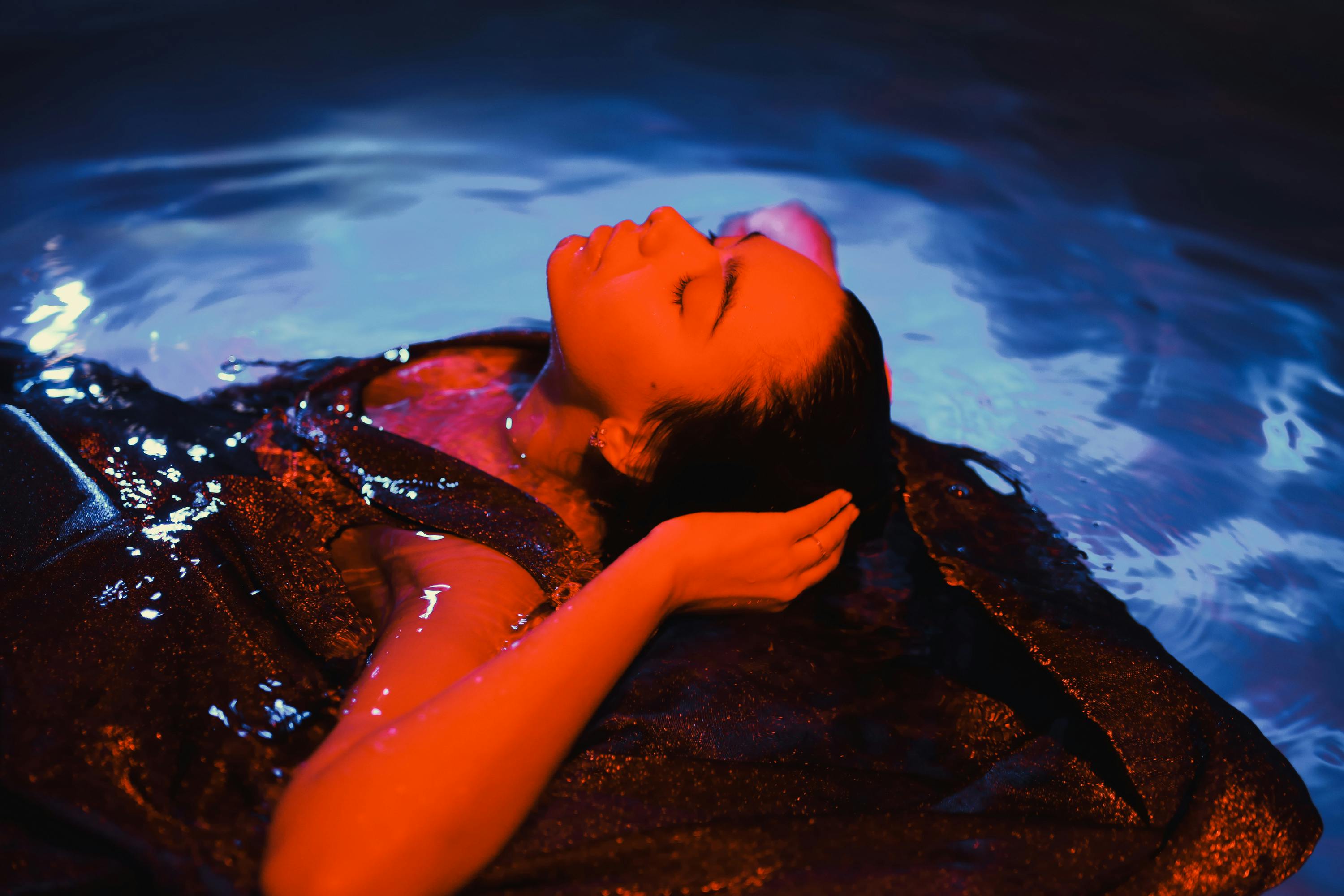 close up photo of woman floating on water