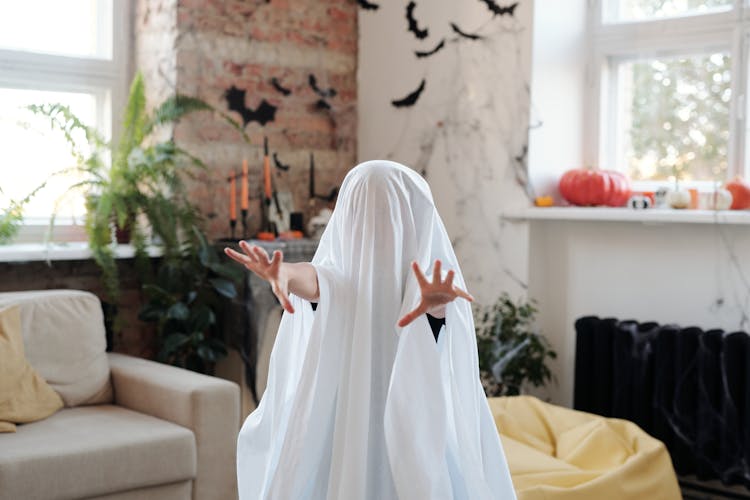 Kid In A Ghost Costume