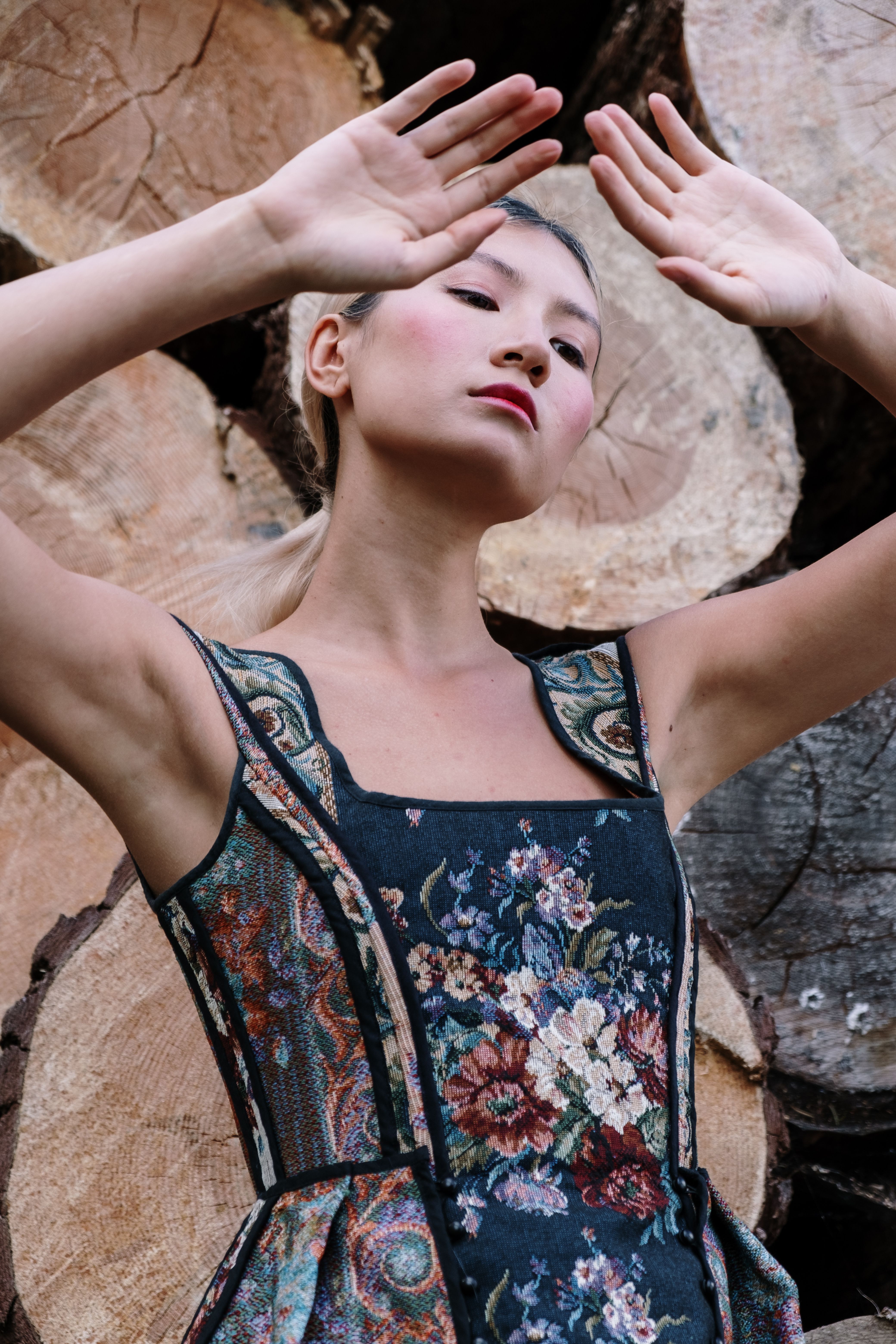 Woman in Floral Dress Posing · Free Stock Photo