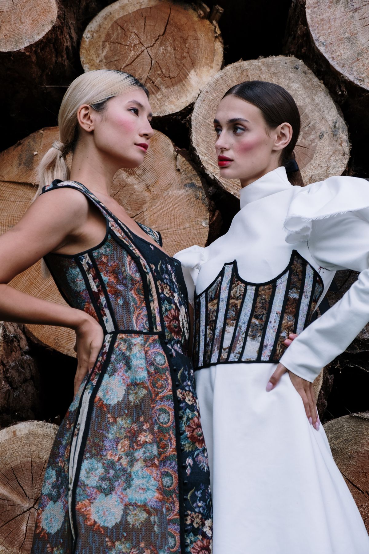 Two elegant women in voluminous dresses — the confident, grown-up ruffle