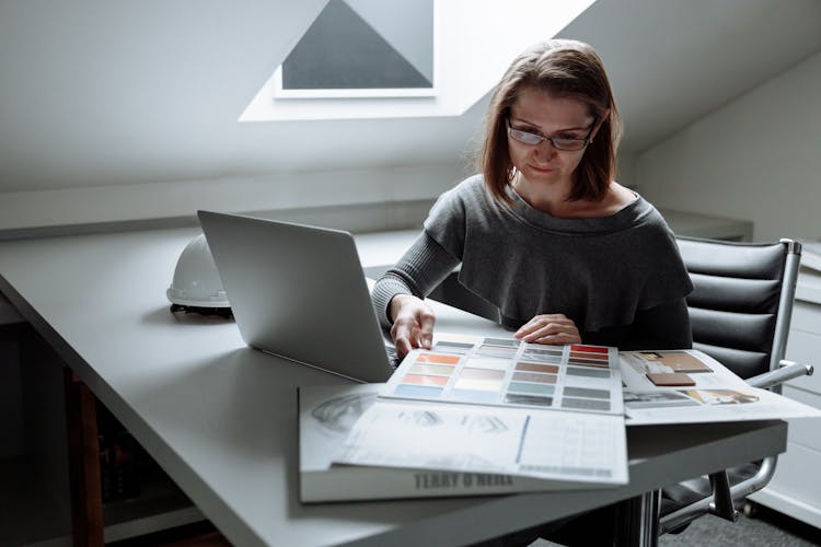 Focused Designer At Her Workspace