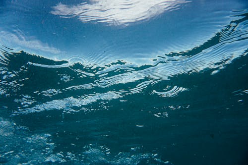 Rippling water with drops of rain