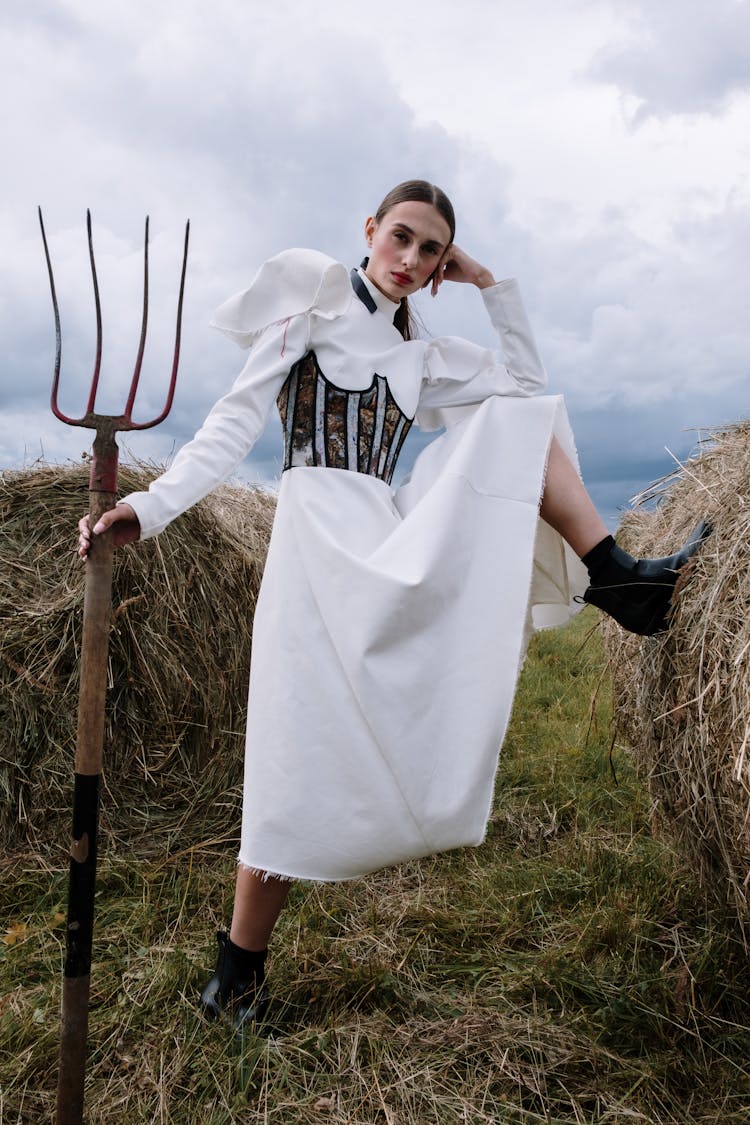 Woman Holding A Fitchfork