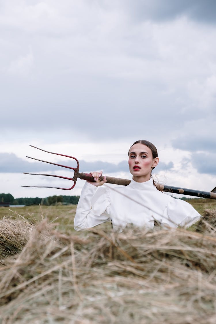 Woman Holding A Pitchfork 