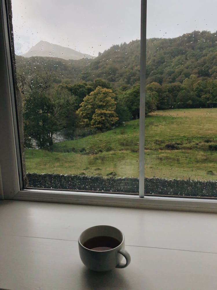 A Cup Of Tea Beside The Window