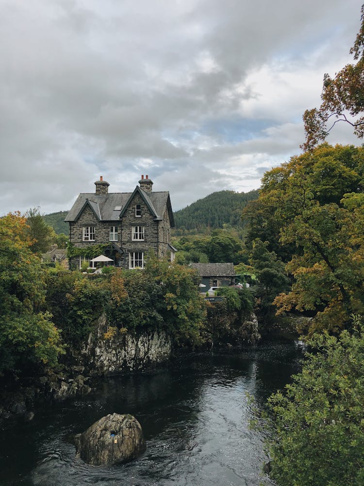 Scenic Photo Of House On Riverside 