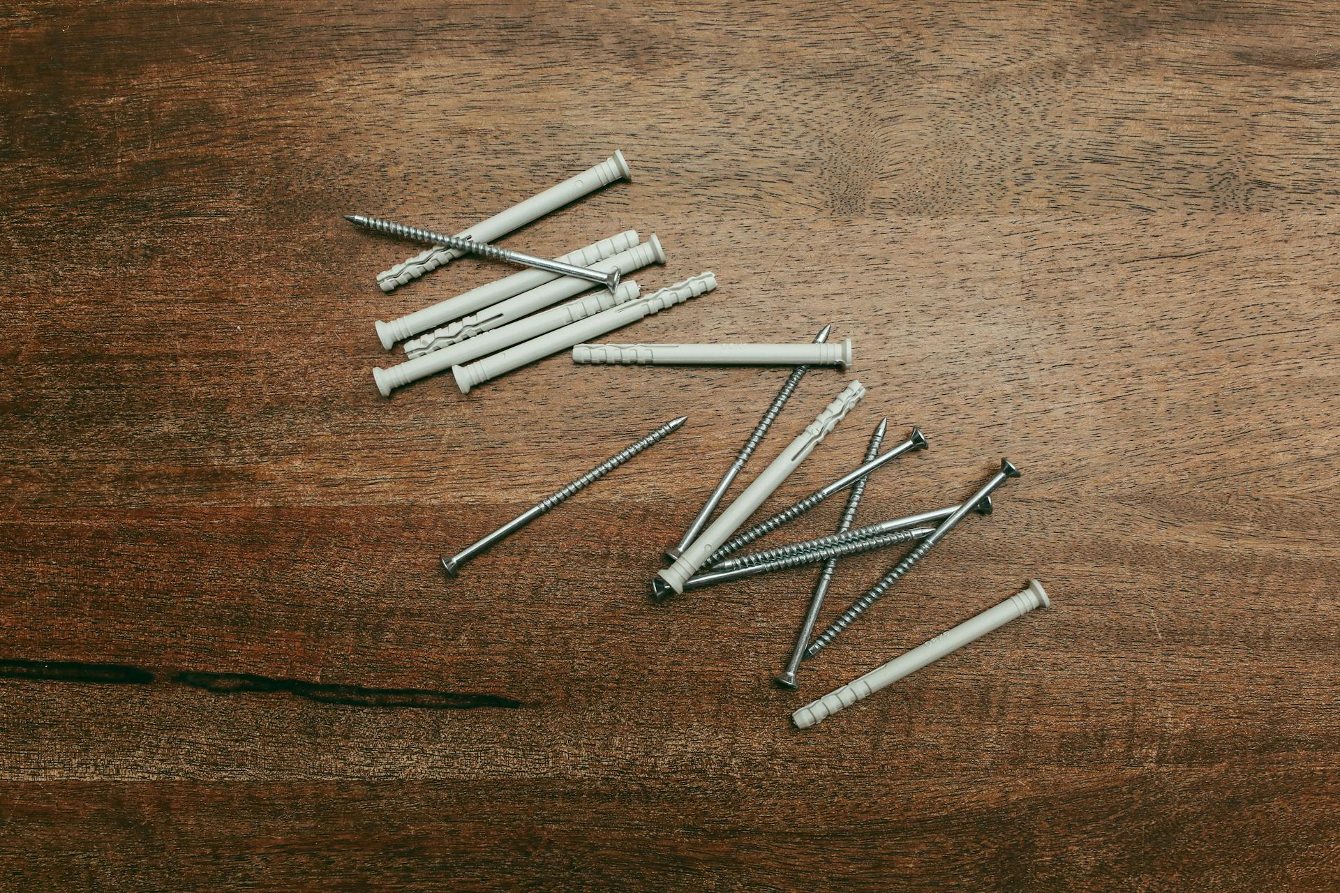 Close-up Photo of Screws and Nylon Fixers