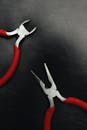 Pliers on a Black Surface