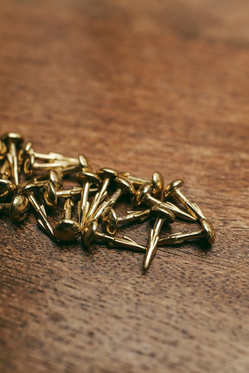 Close-up Photo of Gold Nails 
