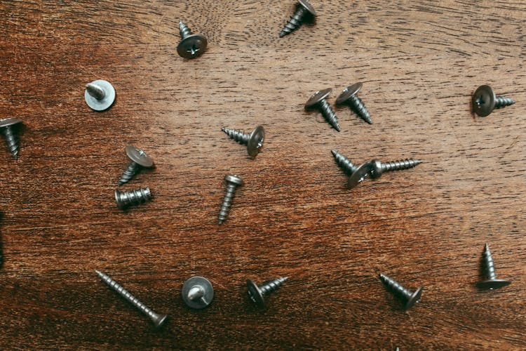 Screws On Wooden Table