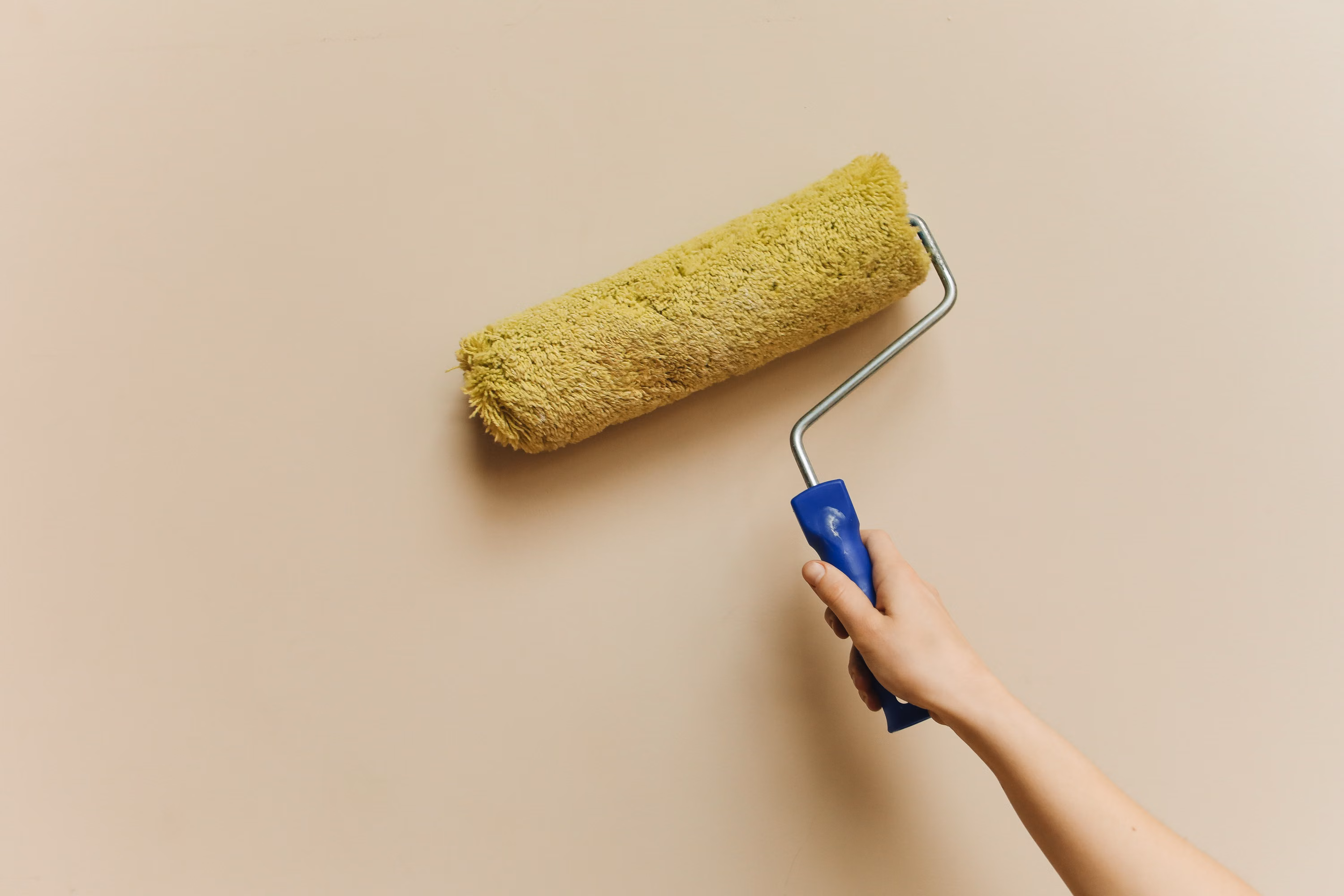 Painter using a wall roller