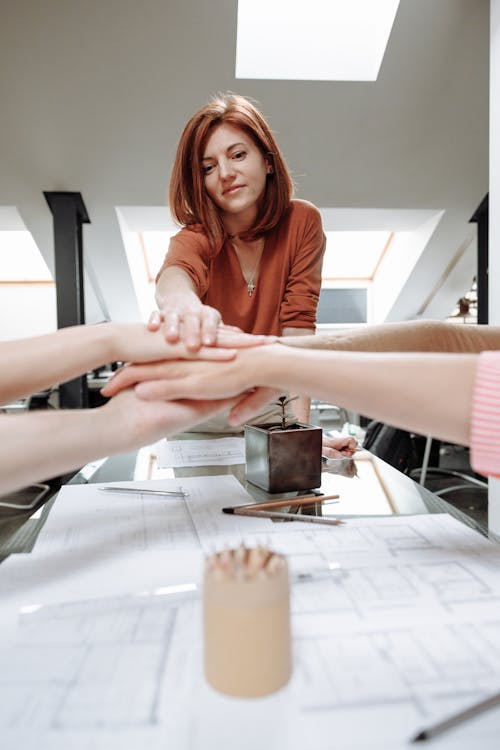 Free A Group of People with Their Hands Together  Stock Photo
