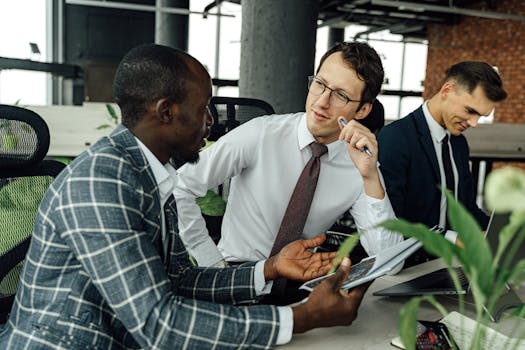 Multicultural business team in a lively discussion around a conference table.