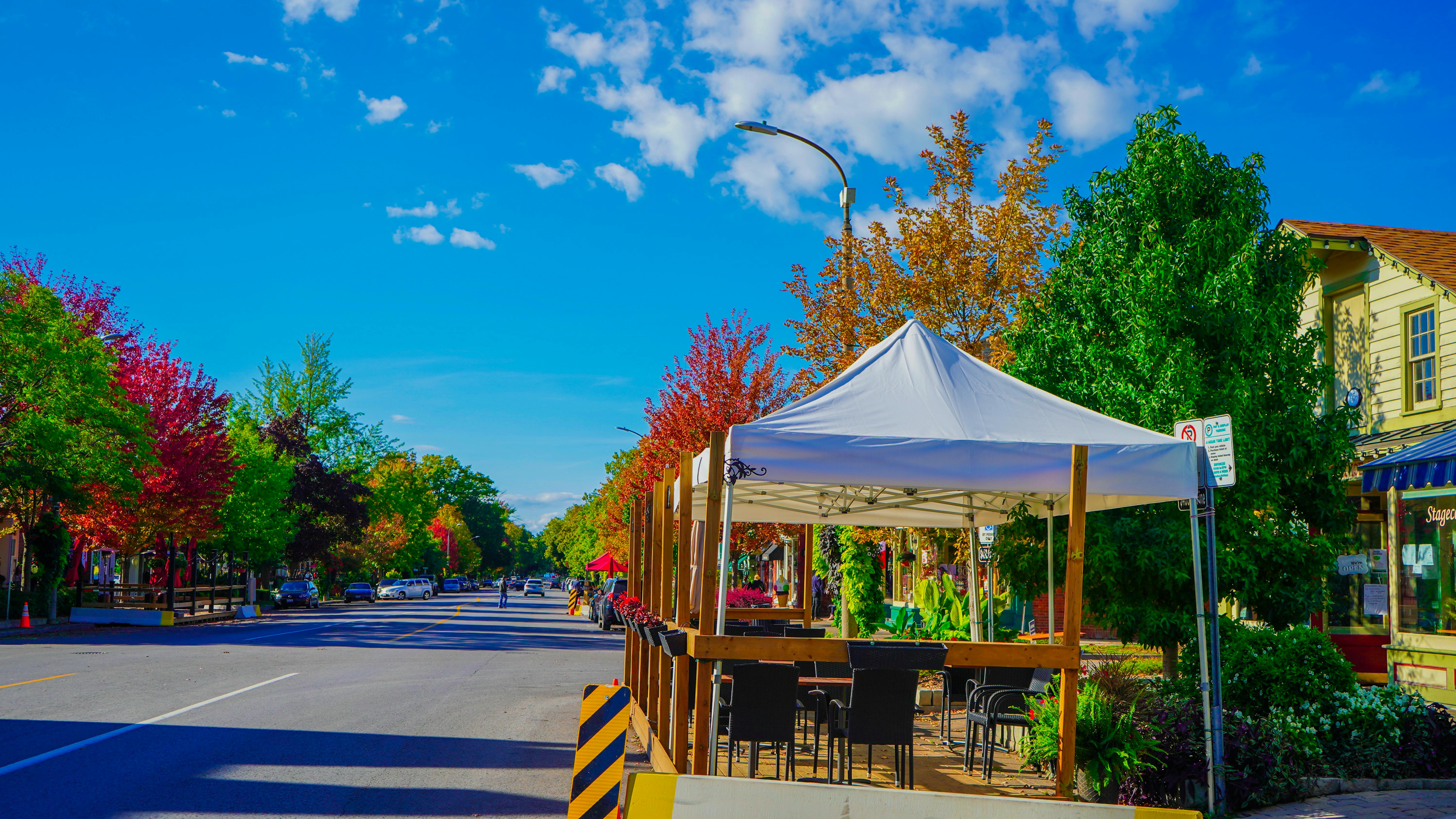 Wrestling ring illuminated by arena lights with a large crowd in the background