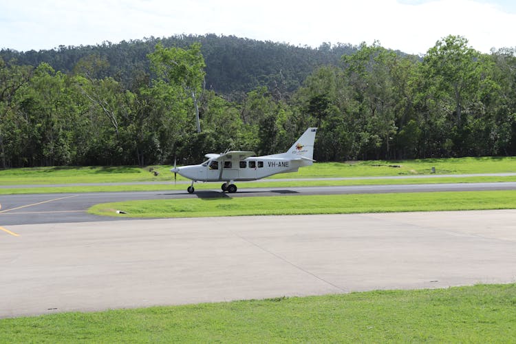 White Airplane Landing On The Airport