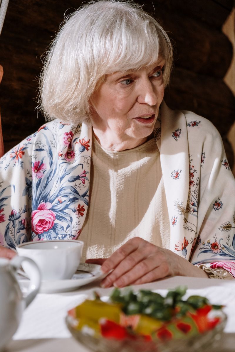 Elderly woman looking thoughtful