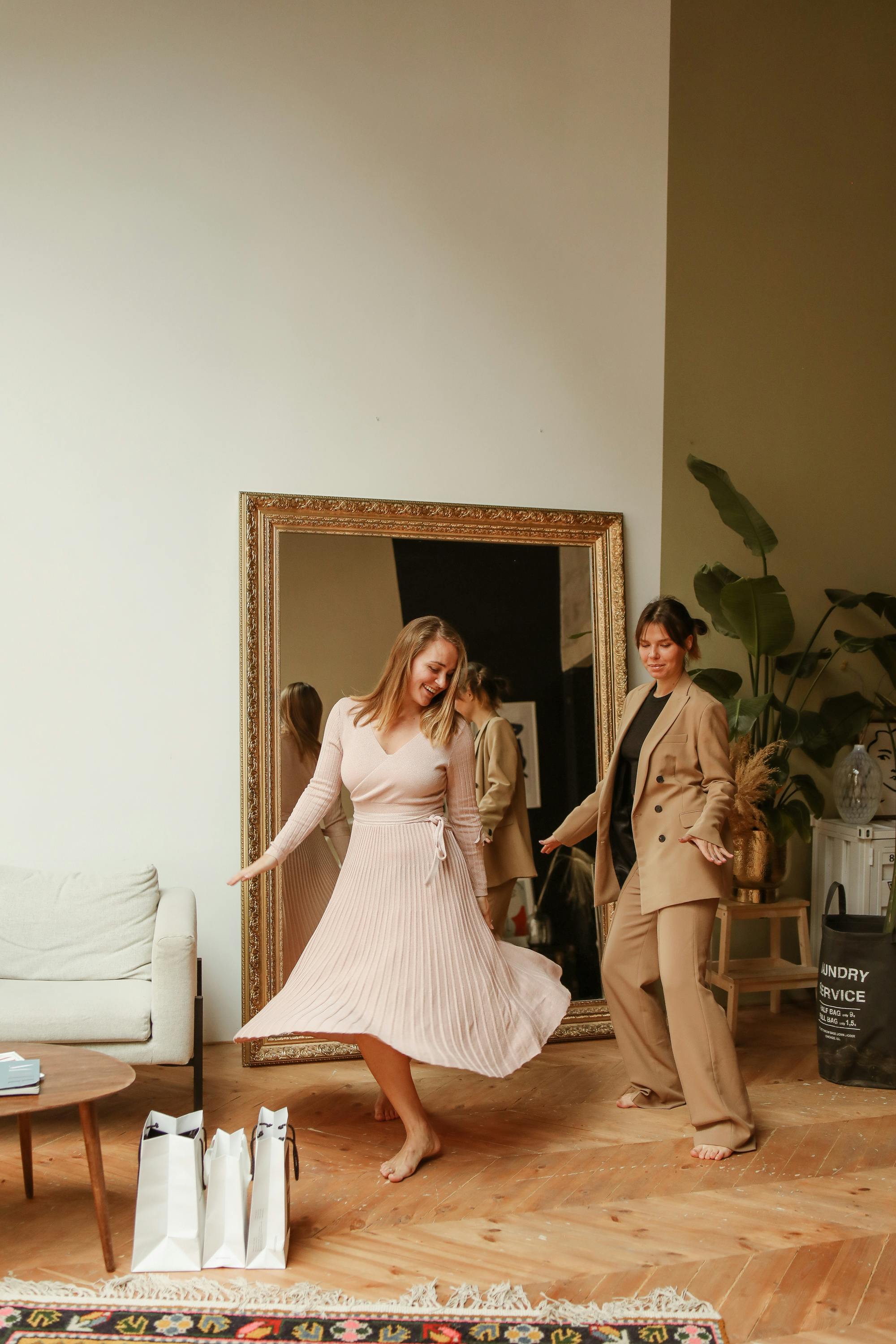 women dancing in front of a mirror