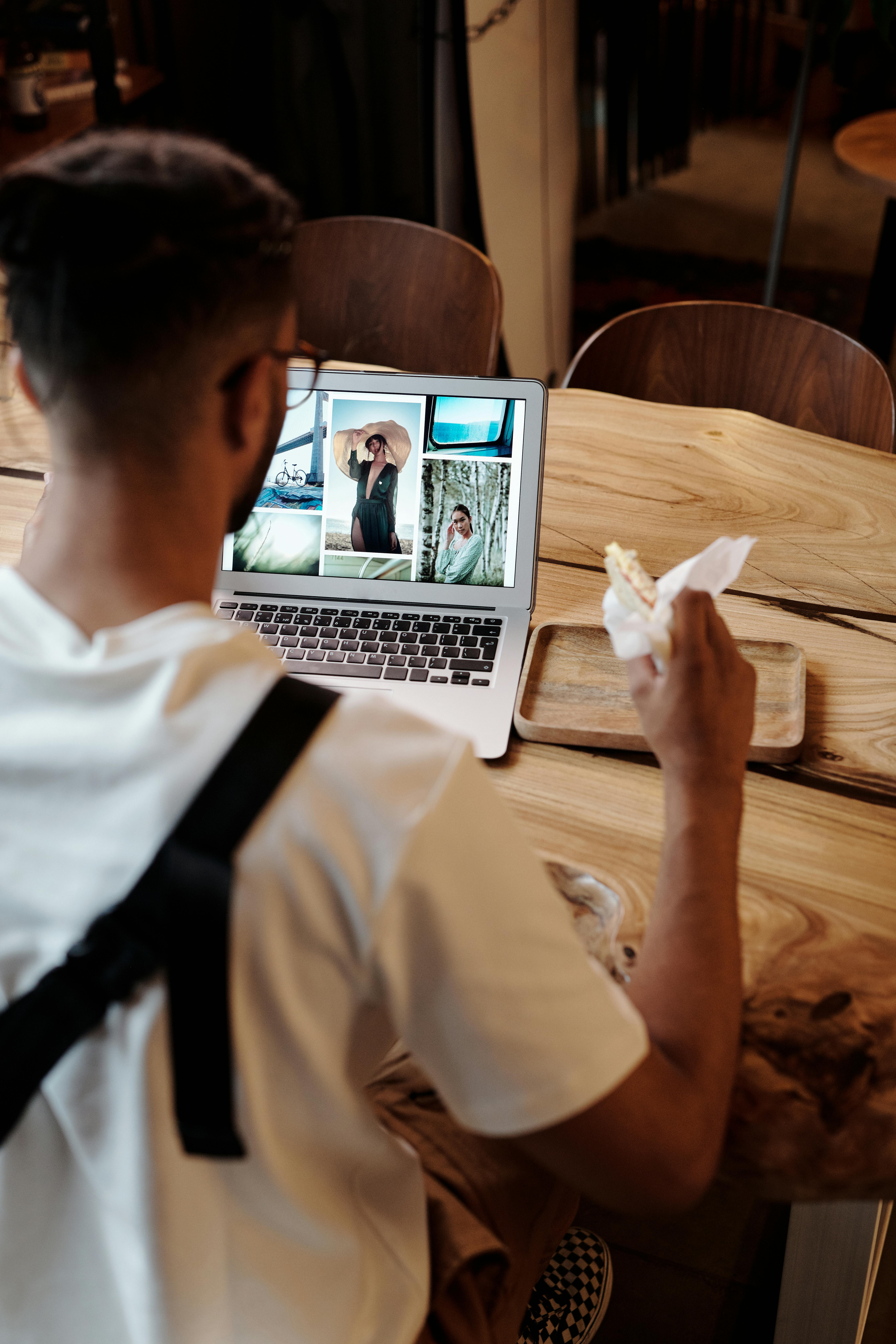 A digital nomad browsing the internet while enjoying a snack at a stylish cafe.