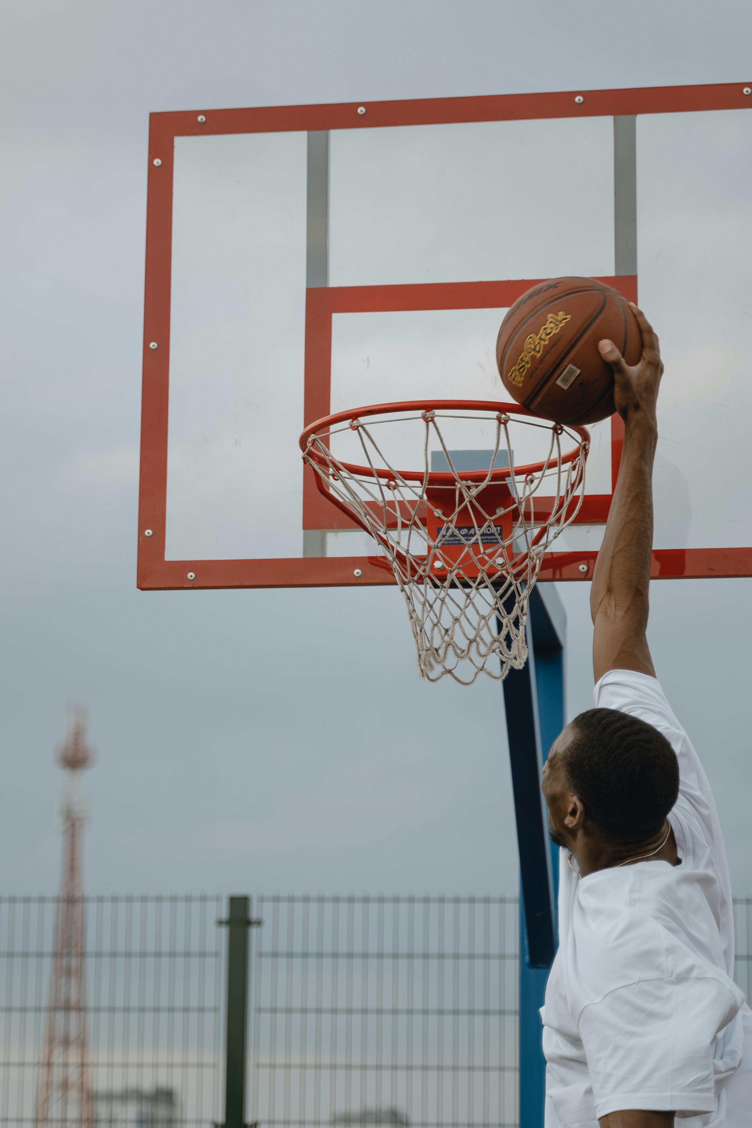 a man dunking a basketball