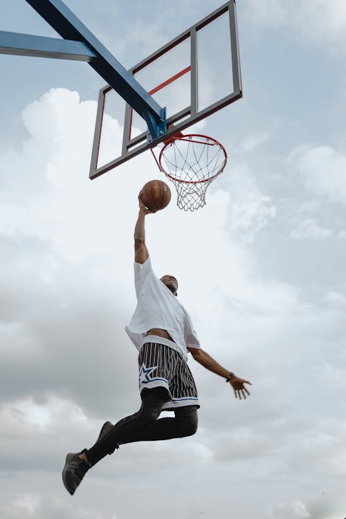 A Man Doing a Dunk · Free Stock Photo