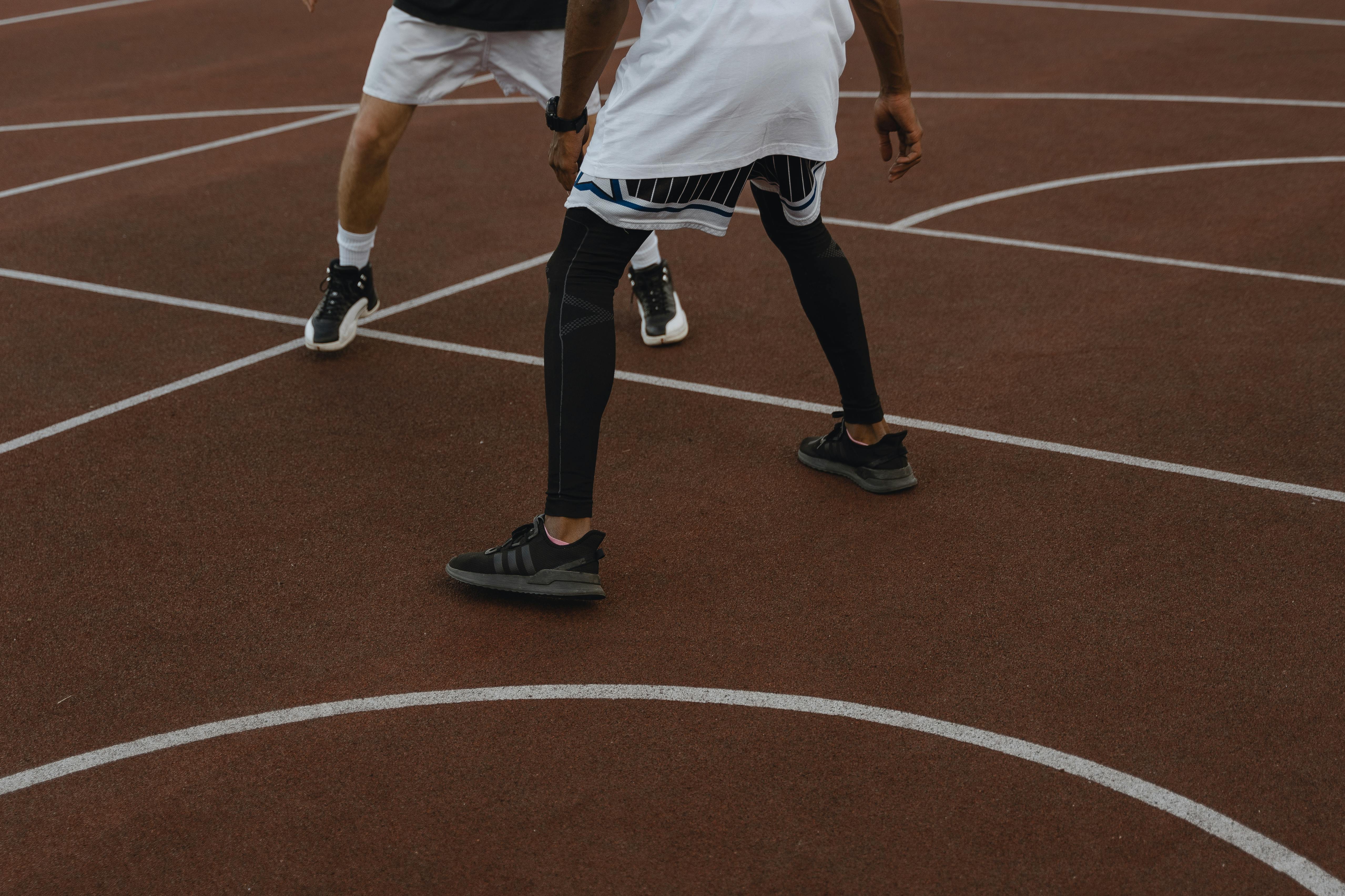 two people playing basketball