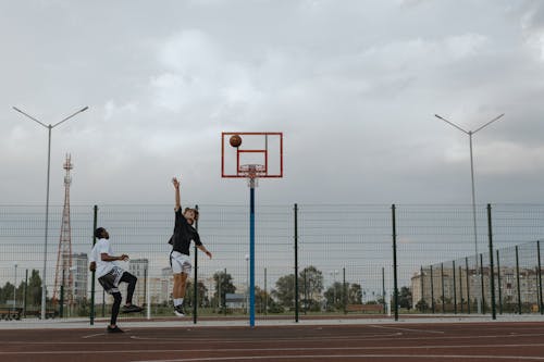 Men Playing Basketball 