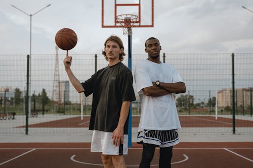  Men Standing on Basketball Court