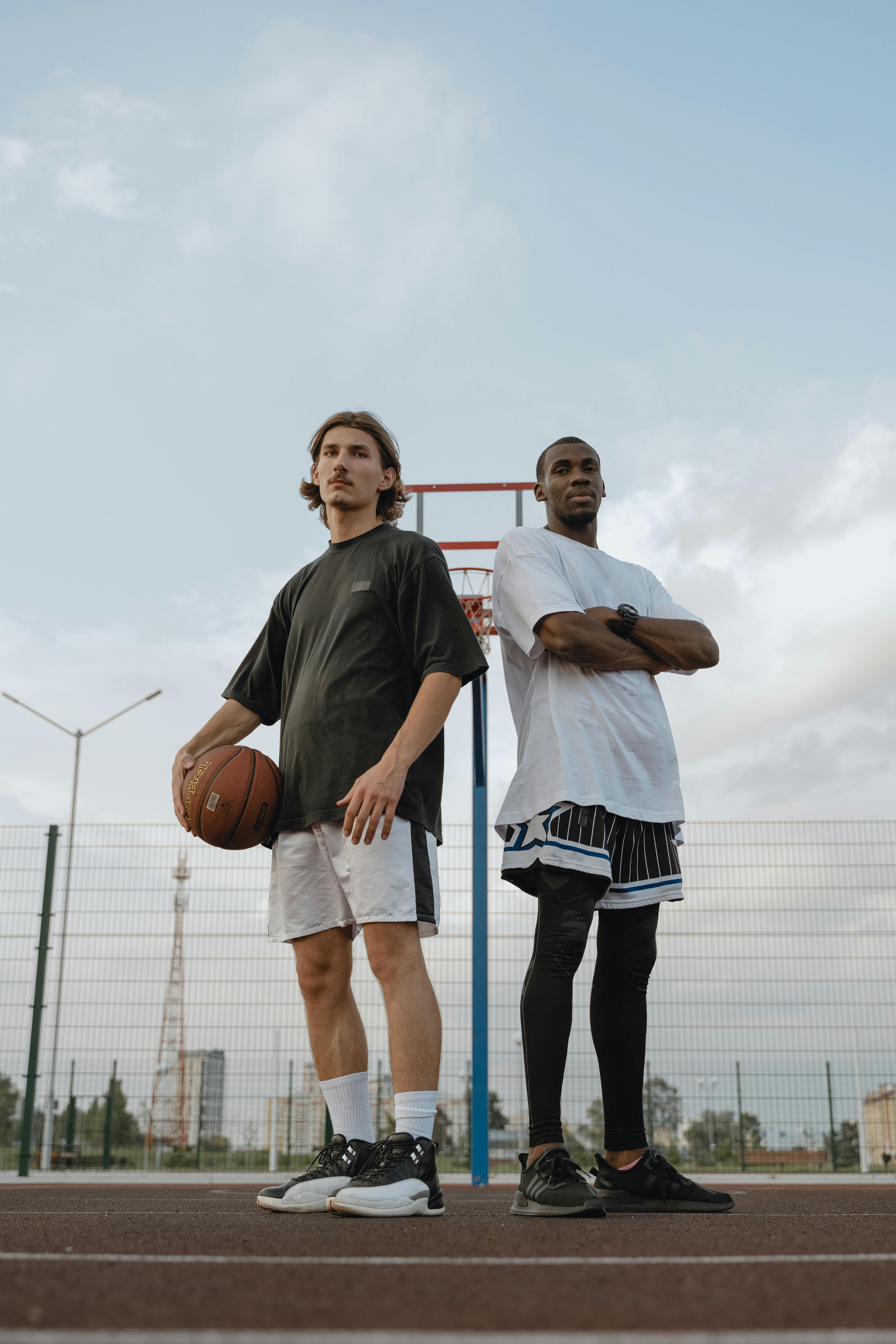 men standing on basketball court