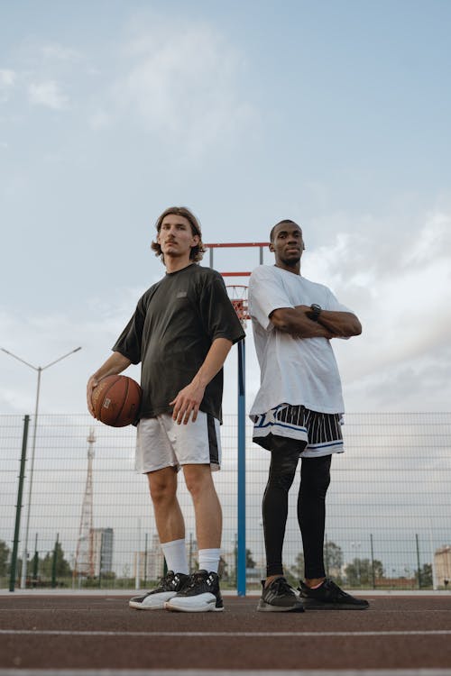 Men Standing on Basketball Court