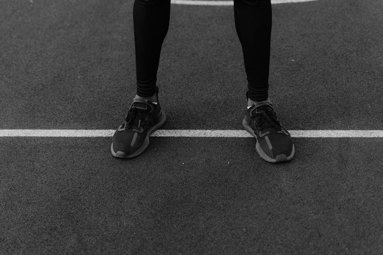 A Person Stepping On A Line