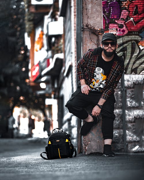 Stylish Man in Plaid Jacket and Black Sunglasses