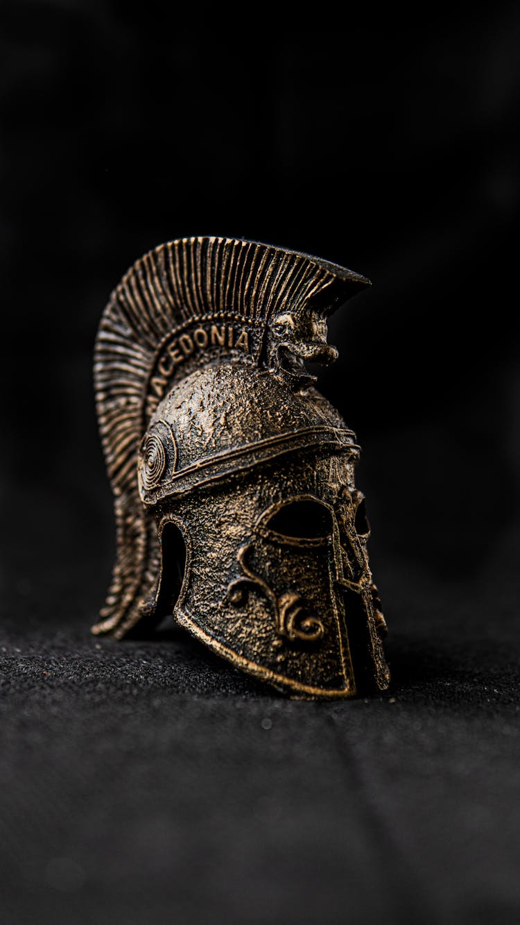 Old Spartan Helmet With Ornament On Black Background