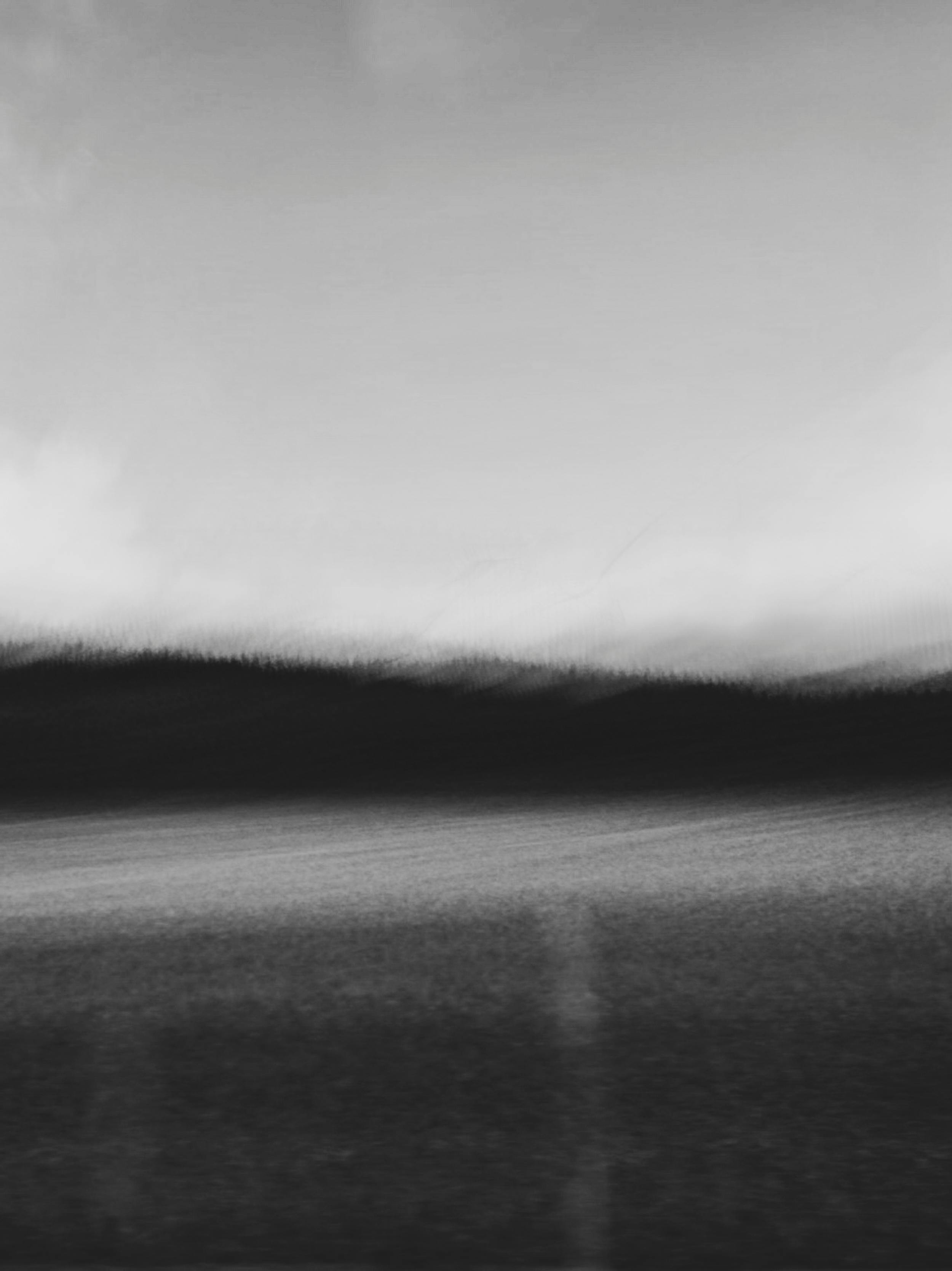 A mysterious and moody abstract landscape captured in black and white tones.
