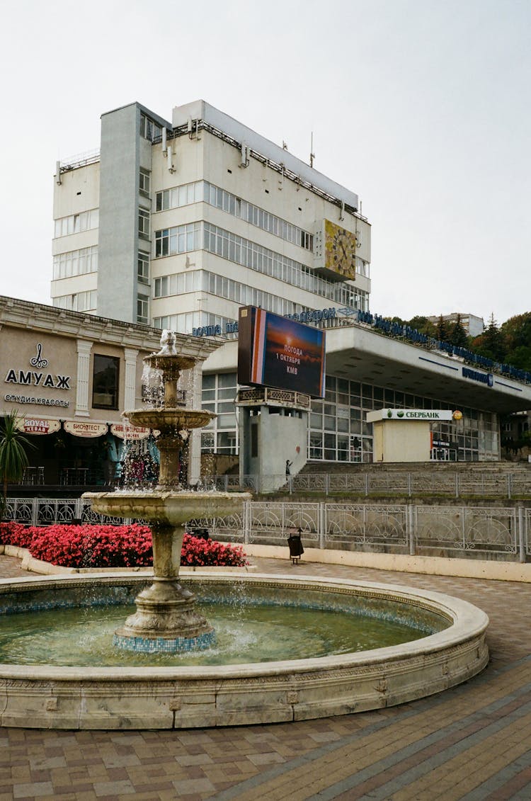 Classic Fountain On Square Near Buildings