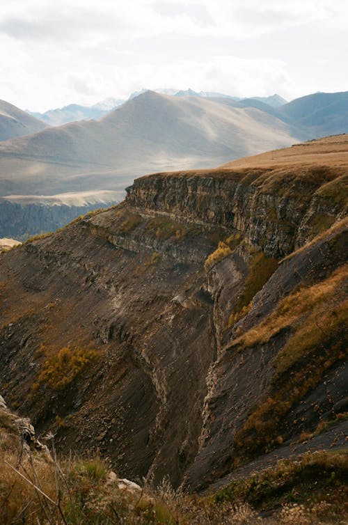 High mountains under cloudy sky in daytime