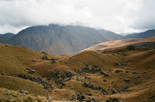 Spectacular mountain ridge against foggy sky