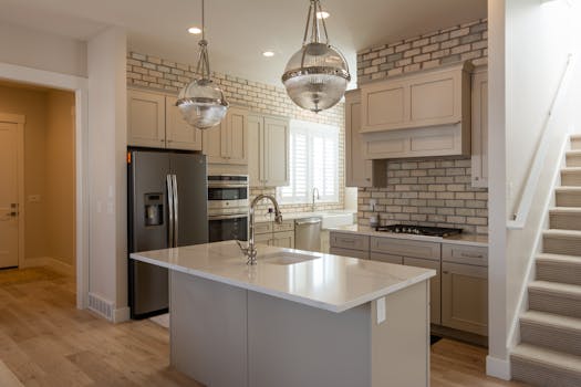 Modern kitchen featuring brick accent, sleek appliances, and stylish lighting for a chic look.