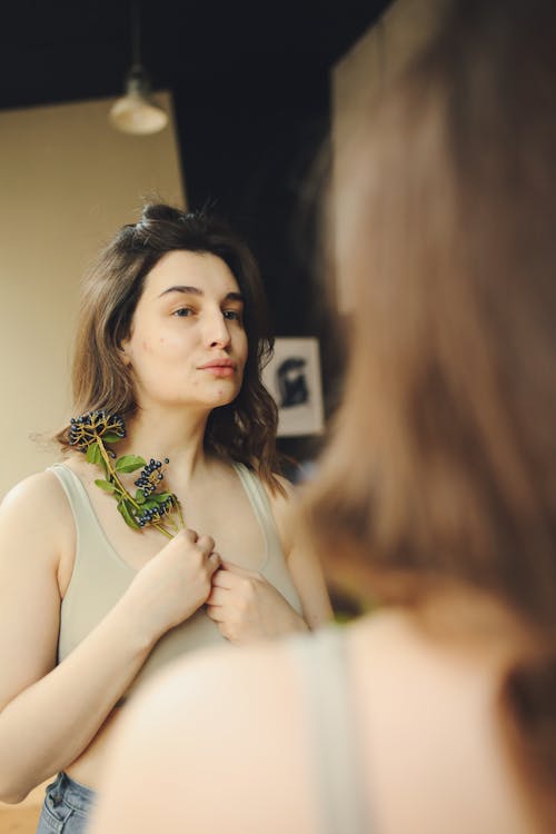 A Woman Looking into a Mirror