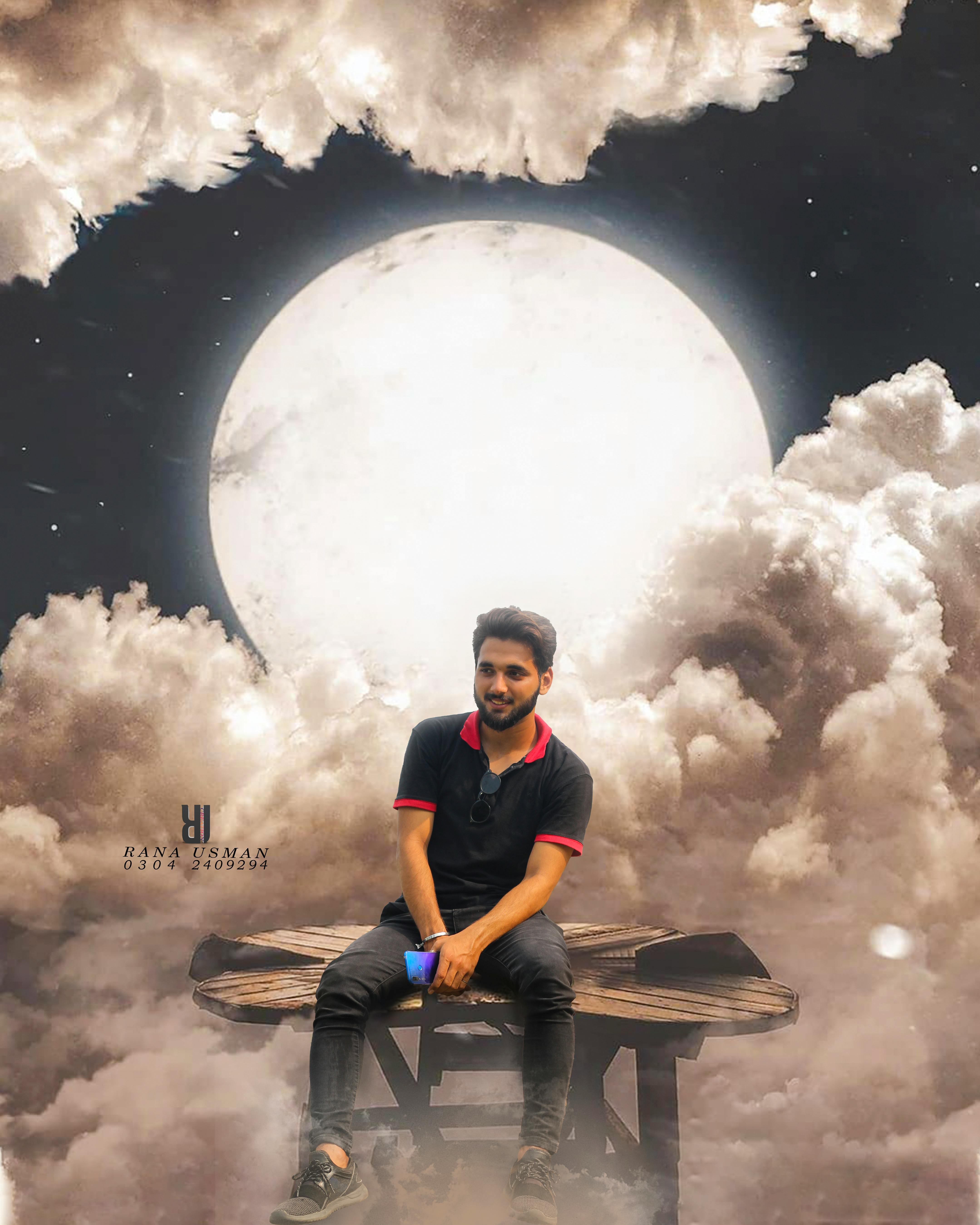 Professional wrestler celebrating with a world championship belt in an arena