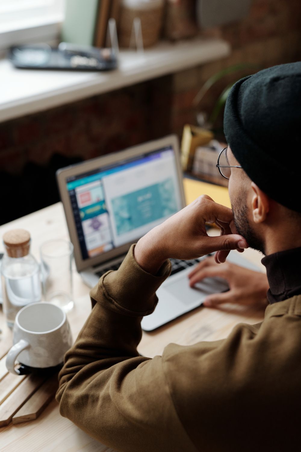 Backview of Man using Laptop · Free Stock Photo