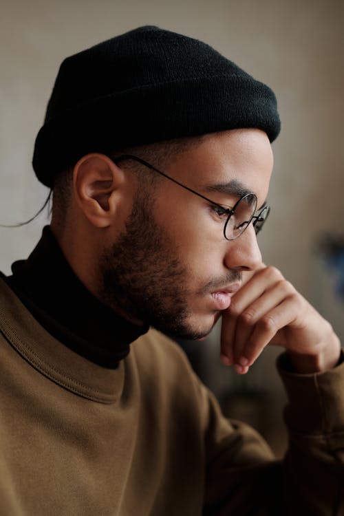 Free Close-up Photo of Man wearing Black Beanie and Black Framed Glasses Stock Photo