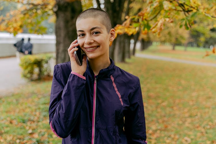 Woman In Purple Jacket Receives A Phone Call 