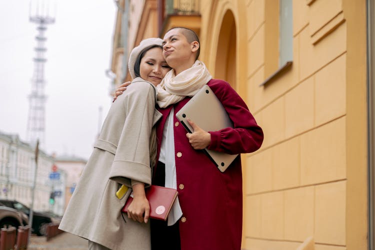 Female Friends Hugging Each Other 